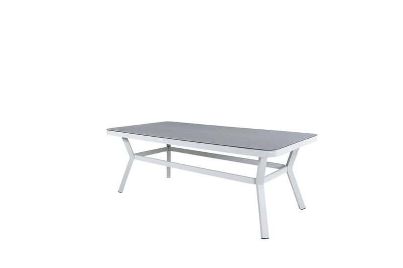 Virya - robust matbord med plats för hela familjen. Tillverkat med en bordsskiva i glas och ett underrede i vit aluminium. Ett matbord för utebruk som skapar en härlig känsla i uterummet såväl som i trädgården. Matcha med ett par matstolar i samma serie f