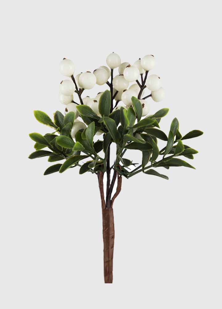 konstgjord växt, en 20 centimeter hög brun kvist med mörkgröna blad med bruna kvistar med vita små bär.
